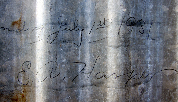 Signature on the front wall of the cabin, signed by the builder Amby Harper in 1931