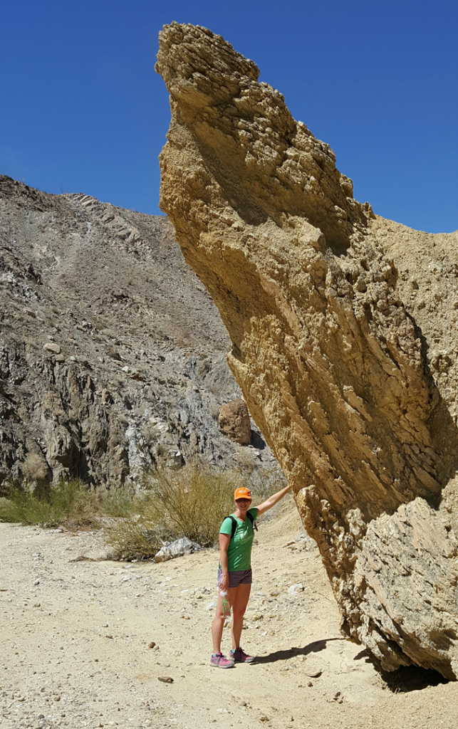 Mary prevents a large rock from teetering over - Domelands Anza Borrego